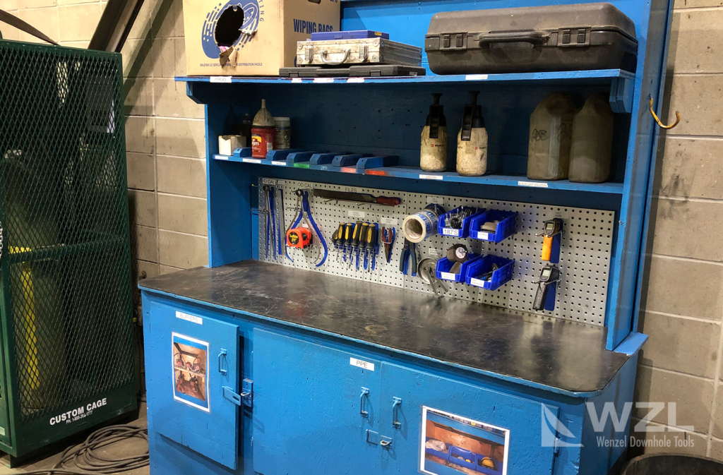 A workstation following 5S methodology for efficiency, safety and quality optimization. Note the shadow board, photos of what is inside the cupboards and well organized tools/paperwork.