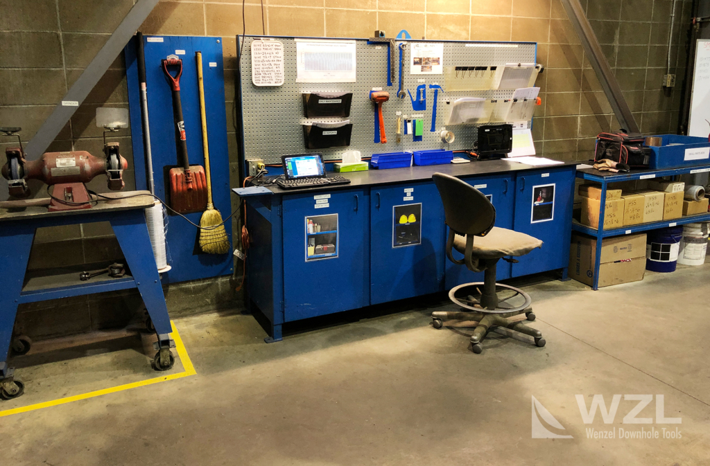 A workstation following 5S methodology for efficiency, safety and quality optimization. Note the shadow board, photos of what is inside the cupboards and well organized tools/paperwork.